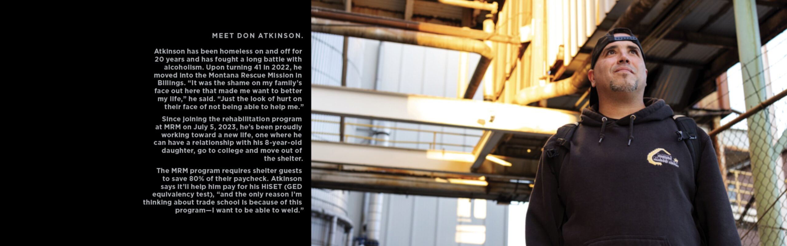 Atkinson standing in front of sugar beet factory