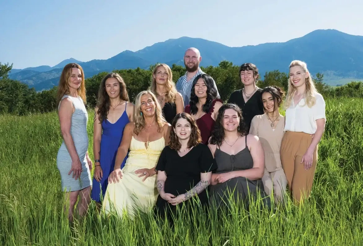 Not Just Jewelry 4 The Alara Jewelry team standing together in a grassy field with mountains behind them