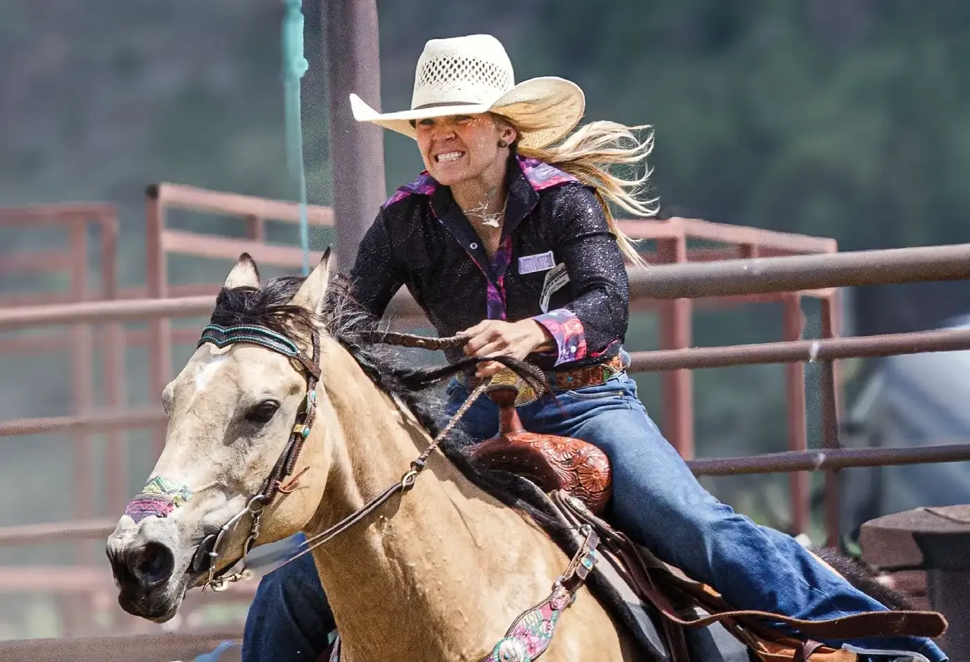 Boot-Top Deep in Montana Rodeo 7 A cowgirl races her horse around a barrel at the Wilsall Rodeo