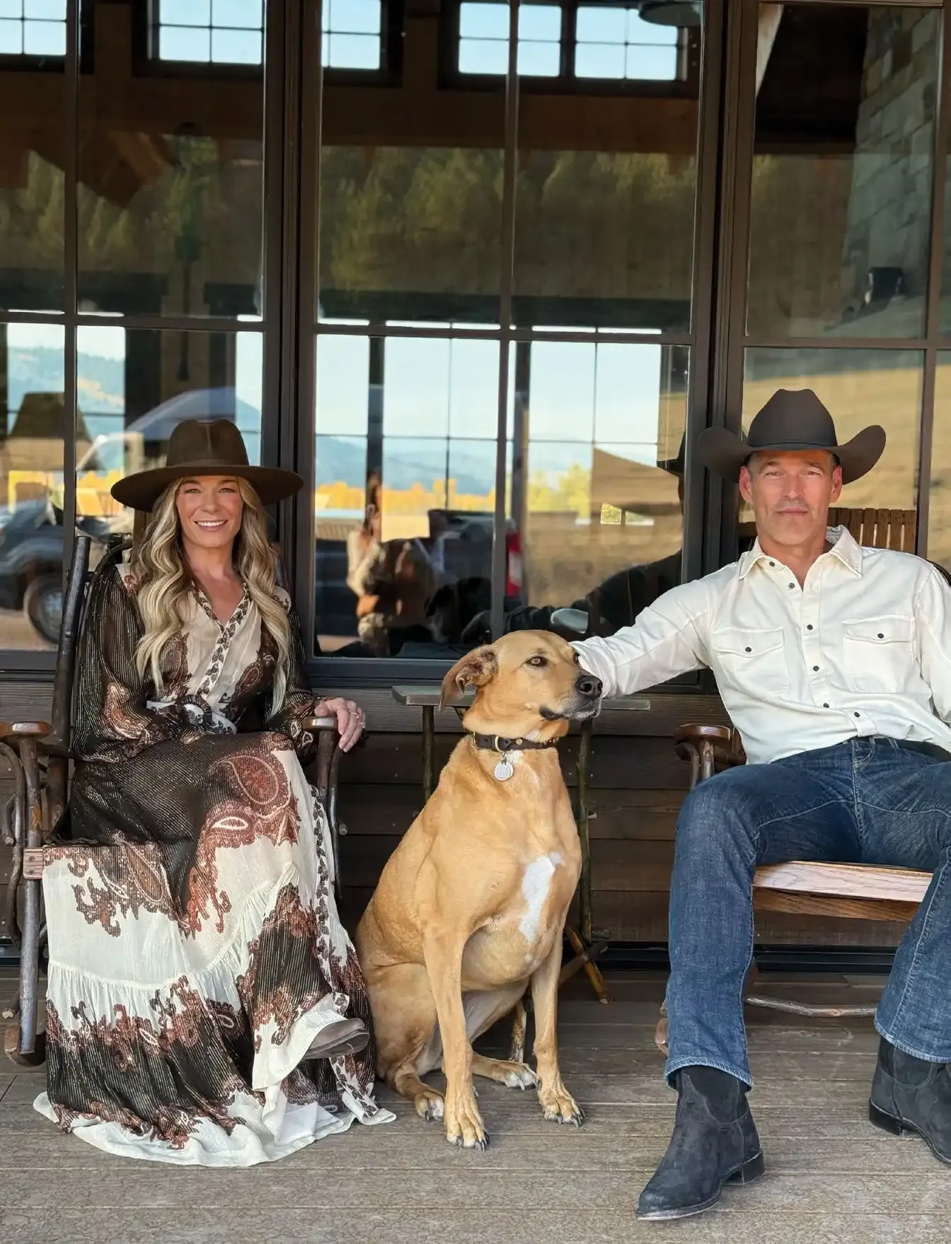 Featured Outlaw: LeAnn Rimes on Montana, Music & the Wildness Within 2 LeAnn Rimes and Eddie Cibrian sitting on a porch with their dog in southwest Montana